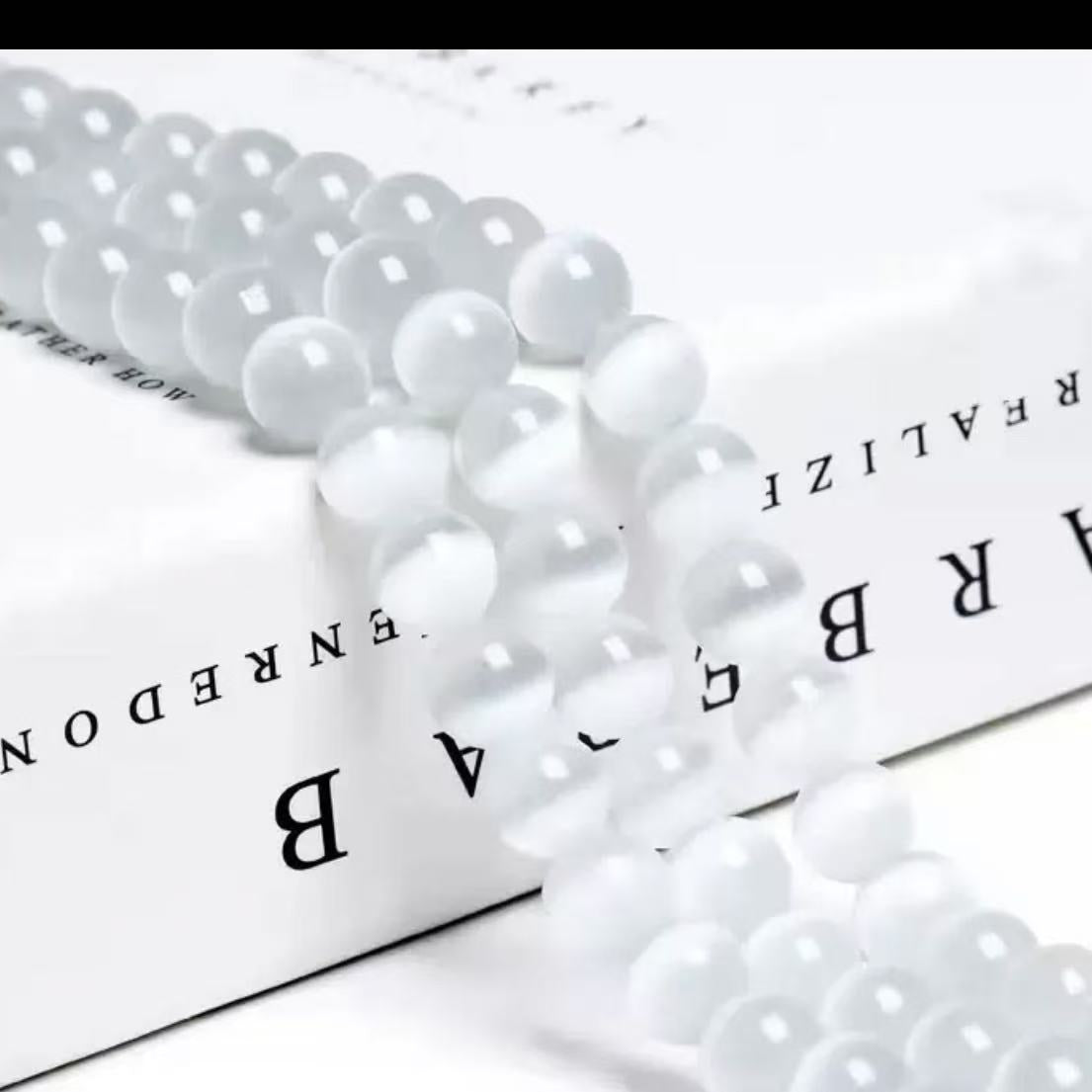 【 A10 】Cat's eye stone beads bind bag- open in live